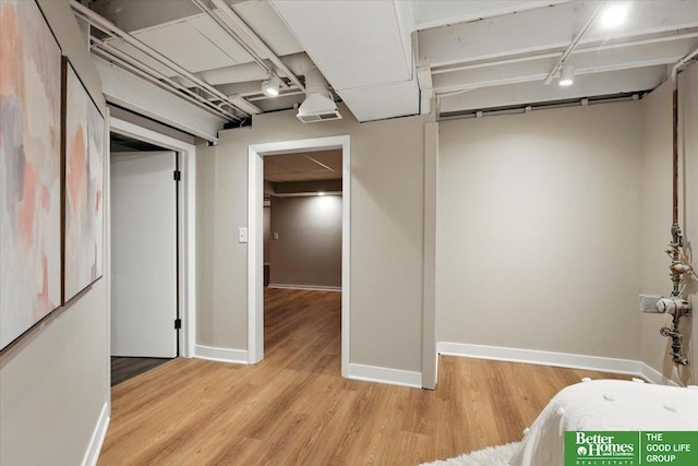 454 N 61st St, Omaha, NE 68132 - finished below grade area featuring light wood-style flooring and baseboards