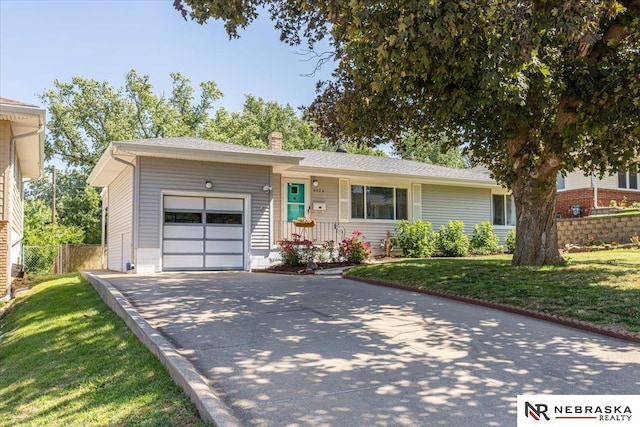 4424 Frederick St, Omaha, NE 68105 - ranch-style house featuring a garage, driveway, and a chimney