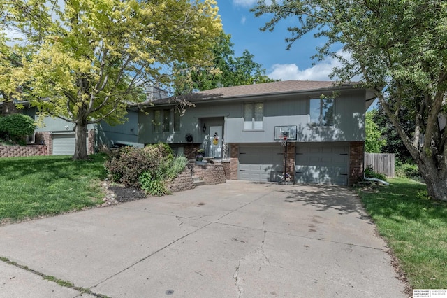 2105 S 164th Ave, Omaha, NE 68130 - raised ranch featuring brick siding, an attached garage, concrete driveway, and a front yard