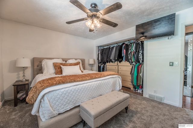 2105 S 164th Ave, Omaha, NE 68130 - carpeted bedroom featuring a closet, a textured ceiling, and a ceiling fan