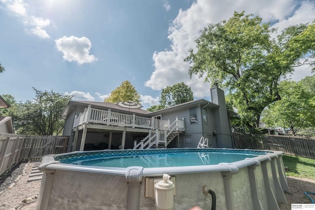 2105 S 164th Ave, Omaha, NE 68130 - view of pool featuring stairway, a deck, and a fenced backyard