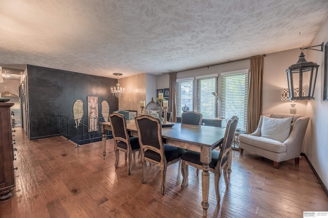 2105 S 164th Ave, Omaha, NE 68130 - dining space with a textured ceiling, hardwood / wood-style floors, and a chandelier