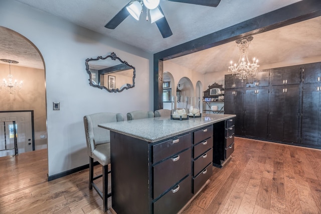 2105 S 164th Ave, Omaha, NE 68130 - kitchen featuring a chandelier, arched walkways, ceiling fan, and beam ceiling