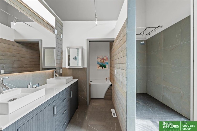 5510 N 83rd St, Omaha, NE 68134 - full bath with track lighting, double vanity, walk in shower, and tile walls
