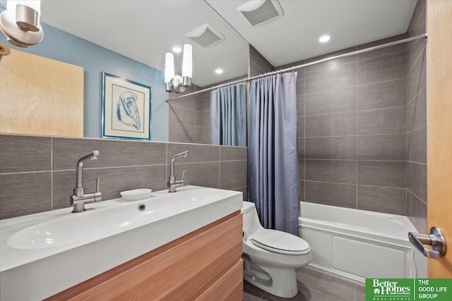 5510 N 83rd St, Omaha, NE 68134 - full bath featuring vanity, shower / tub combo, tile walls, tasteful backsplash, and recessed lighting