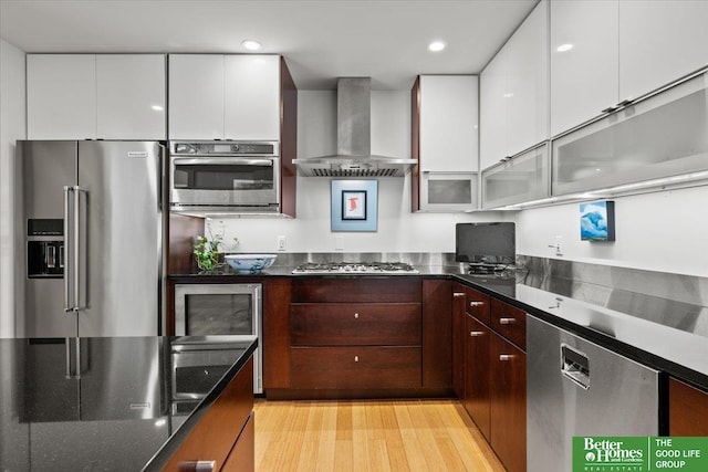 5510 N 83rd St, Omaha, NE 68134 - kitchen with stainless steel appliances, wall chimney exhaust hood, modern cabinets, white cabinets, and recessed lighting
