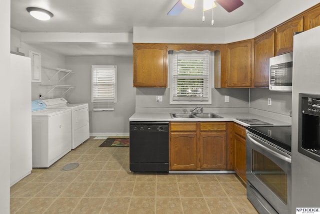 402 W 30th Ave, Bellevue, NE 68005 - kitchen with appliances with stainless steel finishes, separate washer and dryer, light countertops, ceiling fan, and brown cabinets