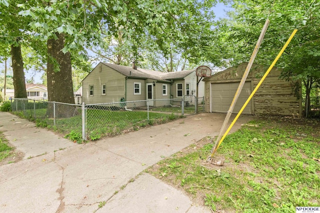 402 W 30th Ave, Bellevue, NE 68005 - view of front of home featuring driveway, a garage, and an outdoor structure