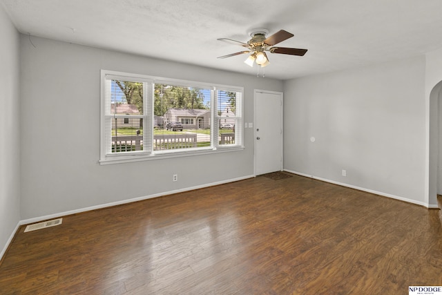 402 W 30th Ave, Bellevue, NE 68005 - empty room with ceiling fan, wood finished floors, and arched walkways