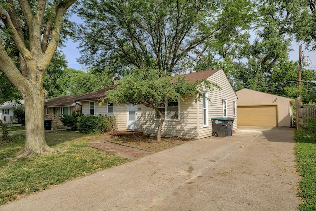 7622 Sherman Dr, Omaha, NE 68134 - view of front of house with a detached garage, an outdoor structure, and a chimney