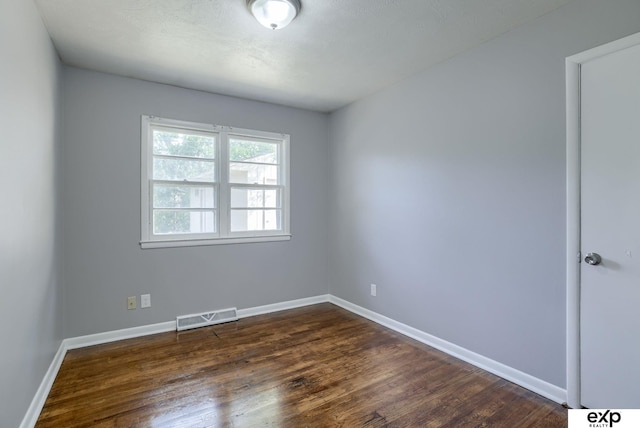 7622 Sherman Dr, Omaha, NE 68134 - spare room with dark wood-type flooring