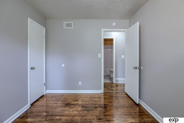 7622 Sherman Dr, Omaha, NE 68134 - unfurnished bedroom with wood finished floors and baseboards
