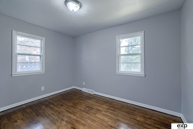7622 Sherman Dr, Omaha, NE 68134 - empty room with baseboards and dark wood-style floors