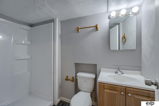7622 Sherman Dr, Omaha, NE 68134 - bathroom featuring vanity, a shower, and a textured ceiling