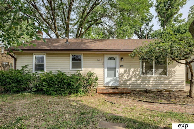 7622 Sherman Dr, Omaha, NE 68134 - ranch-style house with a chimney and roof with shingles