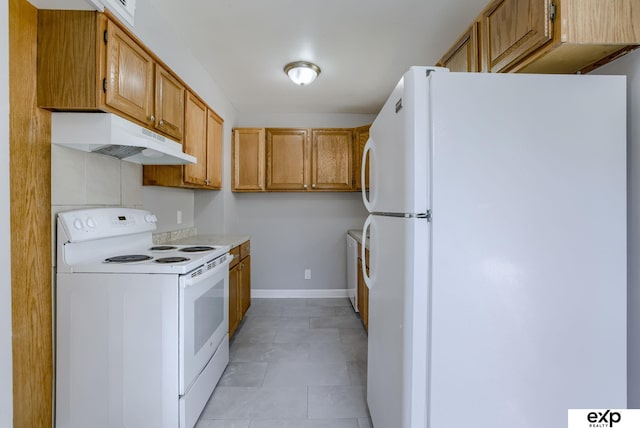 7622 Sherman Dr, Omaha, NE 68134 - kitchen featuring white appliances, under cabinet range hood, brown cabinetry, light countertops, and light tile patterned flooring