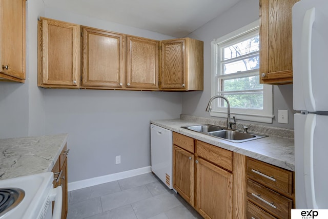 7622 Sherman Dr, Omaha, NE 68134 - kitchen with white appliances, light countertops, and light tile patterned floors