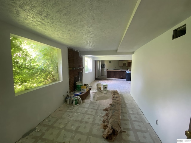 1322 Franklin St, Bellevue, NE 68005 - hallway with tile patterned floors and a textured ceiling