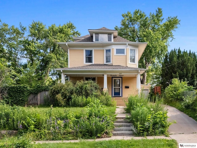2615 C St, Lincoln, NE 68502 - american foursquare style home featuring covered porch and a shingled roof