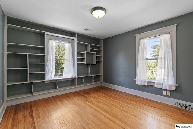 2615 C St, Lincoln, NE 68502 - empty room featuring wood finished floors and baseboards