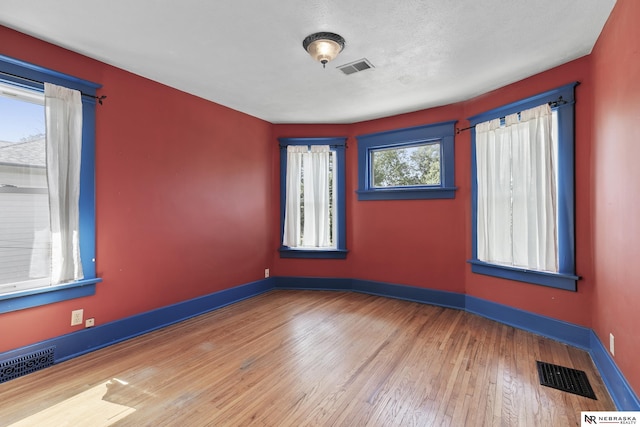 2615 C St, Lincoln, NE 68502 - unfurnished room with hardwood / wood-style floors and baseboards