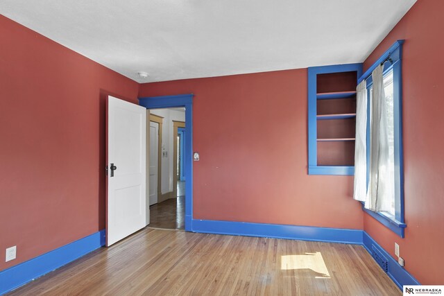 2615 C St, Lincoln, NE 68502 - unfurnished room with wood finished floors and a smoke detector