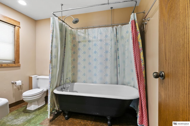 2615 C St, Lincoln, NE 68502 - bathroom with a freestanding tub and a shower with curtain