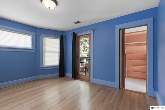 2615 C St, Lincoln, NE 68502 - spare room with wood finished floors
