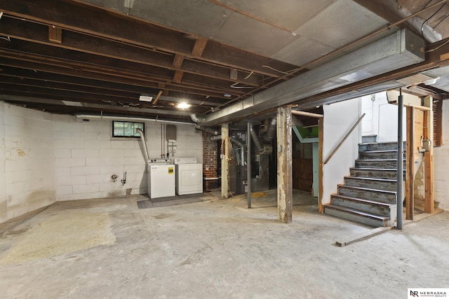 2615 C St, Lincoln, NE 68502 - below grade area with heating unit, washer and clothes dryer, and stairs