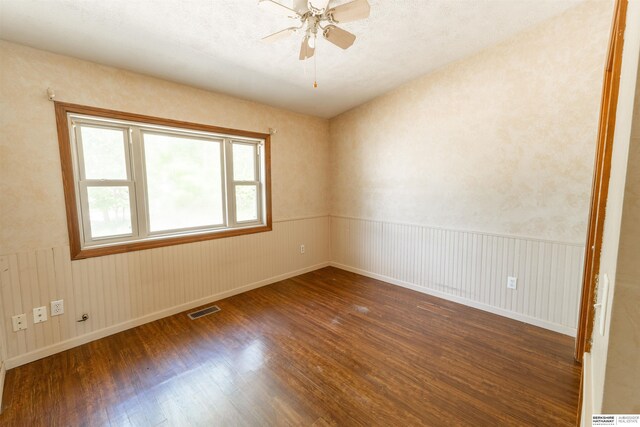 1621 Ridge Rd Lot B, Lot B, Fremont, NE 68025 - empty room with wood finished floors, ceiling fan, and a wainscoted wall