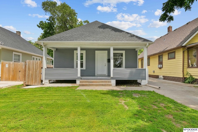 2738 Browne St, Omaha, NE 68111 - view of front of property with a shingled roof and a porch