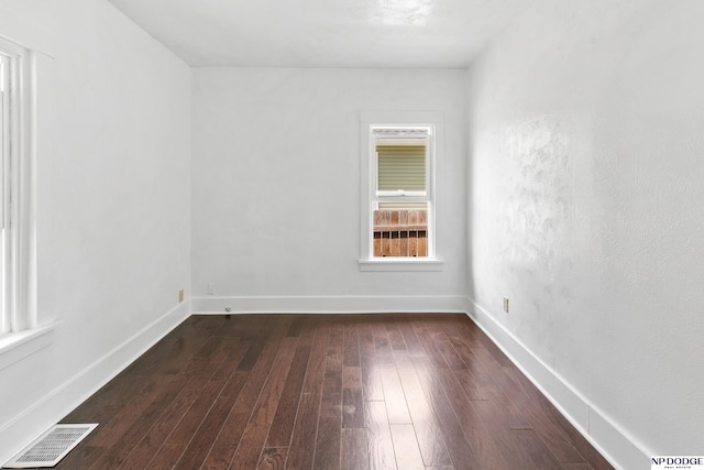 2738 Browne St, Omaha, NE 68111 - empty room featuring dark wood-style floors and baseboards