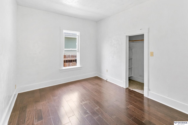 2738 Browne St, Omaha, NE 68111 - unfurnished room with dark wood-style flooring and baseboards
