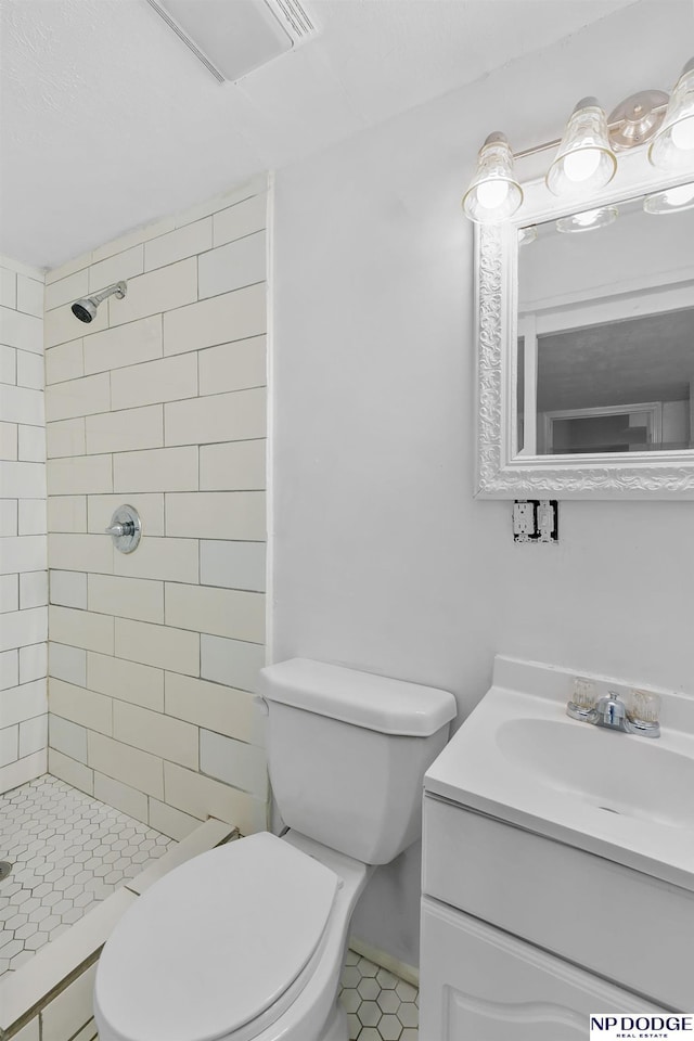 2738 Browne St, Omaha, NE 68111 - bathroom featuring vanity, a tile shower, and tile patterned floors