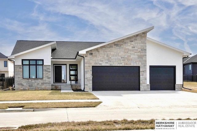 20709 Woodridge Dr, Gretna, NE 68028 - contemporary home with a garage, stone siding, and driveway