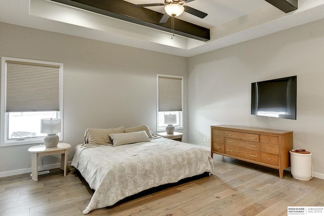 20709 Woodridge Dr, Gretna, NE 68028 - bedroom with a tray ceiling, light wood finished floors, ceiling fan, and beamed ceiling