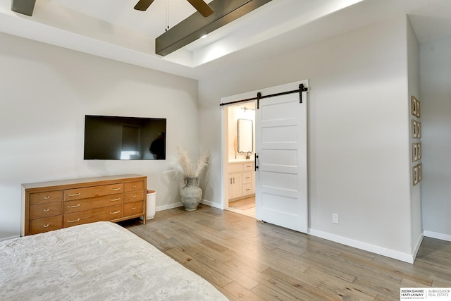 20709 Woodridge Dr, Gretna, NE 68028 - bedroom featuring a barn door, wood finished floors, ensuite bathroom, and ceiling fan