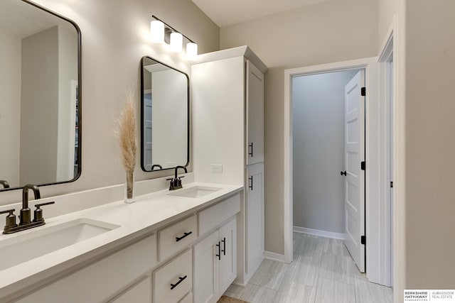 20709 Woodridge Dr, Gretna, NE 68028 - bathroom featuring double vanity and baseboards