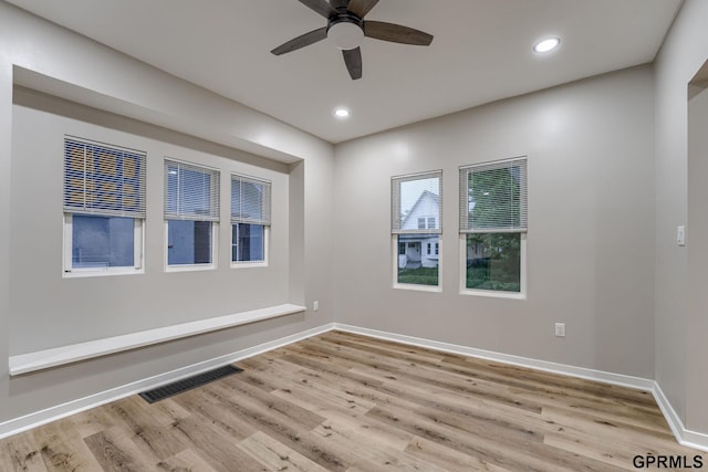 2551 Meredith Ave, Omaha, NE 68111 - unfurnished room with wood finished floors, a ceiling fan, and recessed lighting