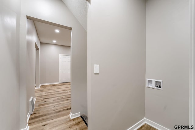 2551 Meredith Ave, Omaha, NE 68111 - laundry area featuring washer hookup, light wood finished floors, and recessed lighting