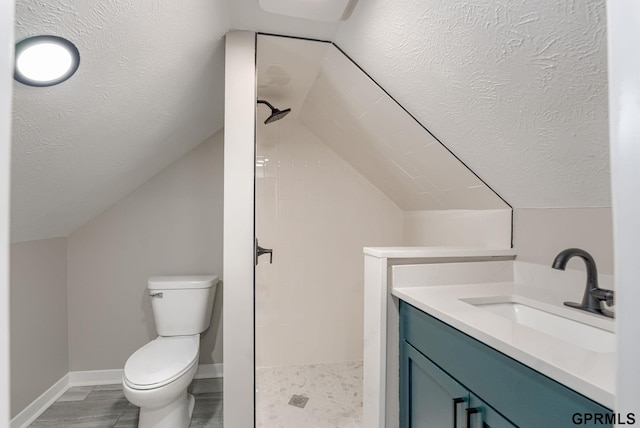 2551 Meredith Ave, Omaha, NE 68111 - full bath with a tile shower, vaulted ceiling, and vanity