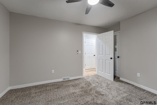 2551 Meredith Ave, Omaha, NE 68111 - unfurnished bedroom with carpet floors and a ceiling fan