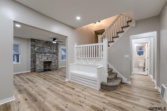 2551 Meredith Ave, Omaha, NE 68111 - stairway featuring wood finished floors and a ceiling fan
