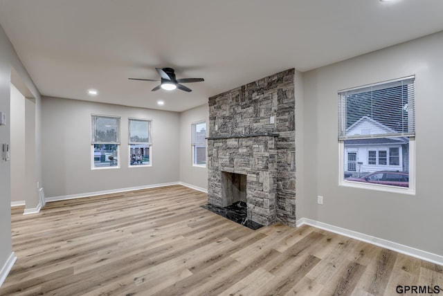 2551 Meredith Ave, Omaha, NE 68111 - unfurnished living room with ceiling fan, wood finished floors, a fireplace, and recessed lighting