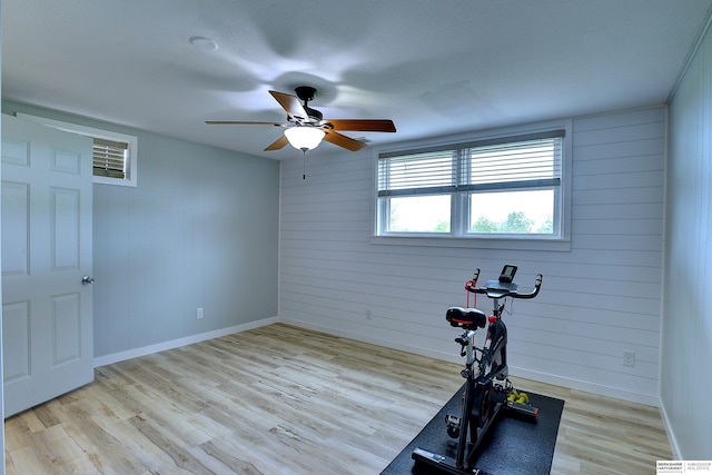 4625 S 222nd St, Elkhorn, NE 68022 - exercise area with light wood finished floors, wood walls, and ceiling fan