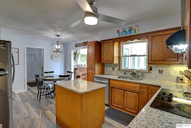 4625 S 222nd St, Elkhorn, NE 68022 - kitchen with appliances with stainless steel finishes, range hood, a center island, and decorative backsplash