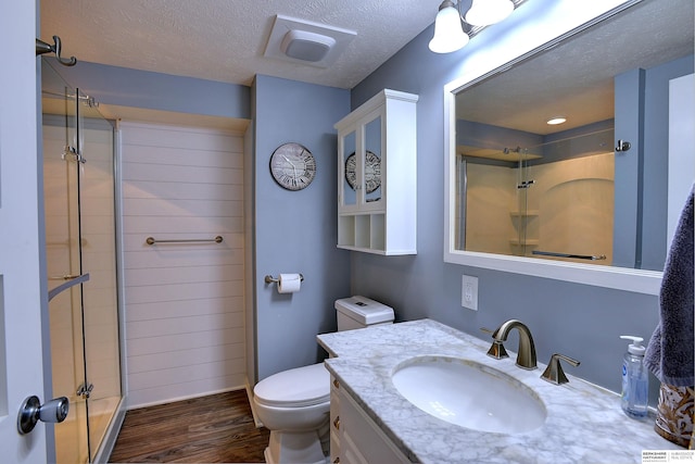 4625 S 222nd St, Elkhorn, NE 68022 - full bath with wood finished floors, vanity, a shower, and a textured ceiling