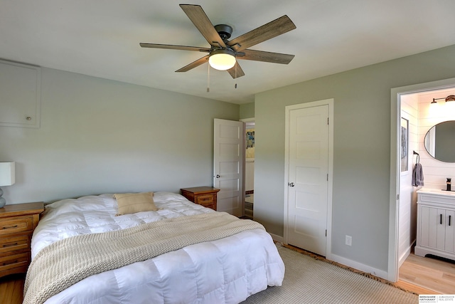 4625 S 222nd St, Elkhorn, NE 68022 - bedroom featuring ensuite bathroom, ceiling fan, and light wood-type flooring