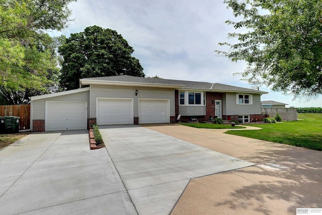 4625 S 222nd St, Elkhorn, NE 68022 - bi-level home with a garage, brick siding, and concrete driveway