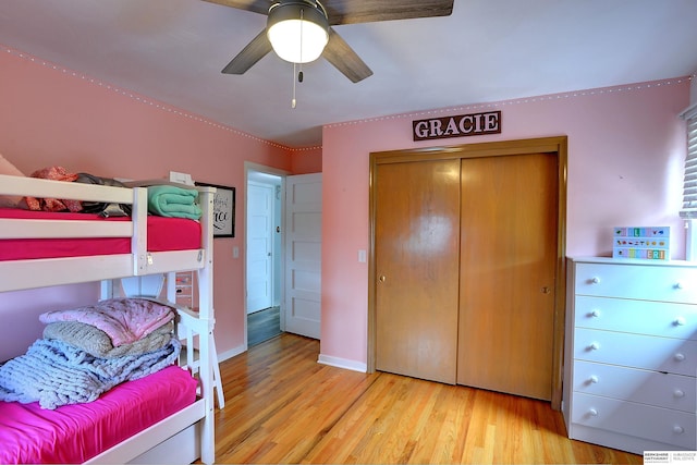 4625 S 222nd St, Elkhorn, NE 68022 - bedroom with wood finished floors, a closet, and a ceiling fan